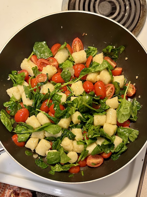 Gnocchi with tomatoes and spinach