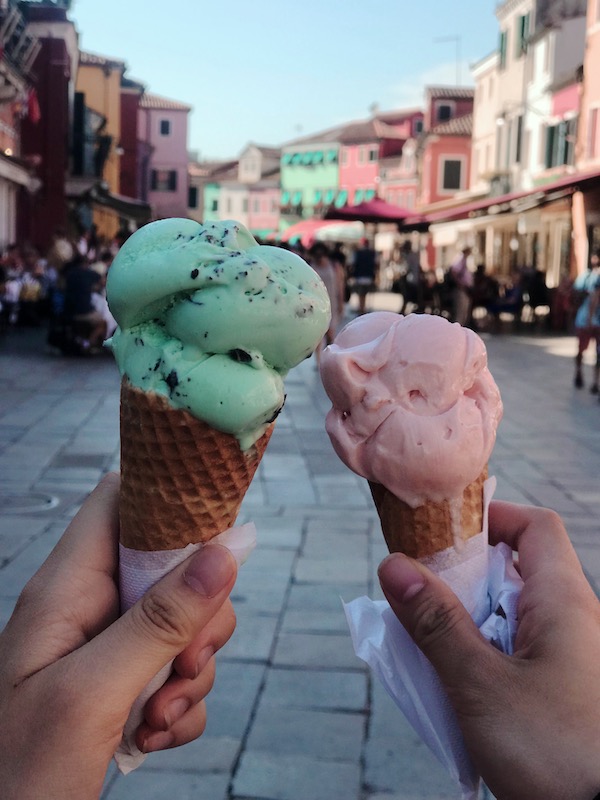 Green and pink gelato cones pictured in streets of Venice